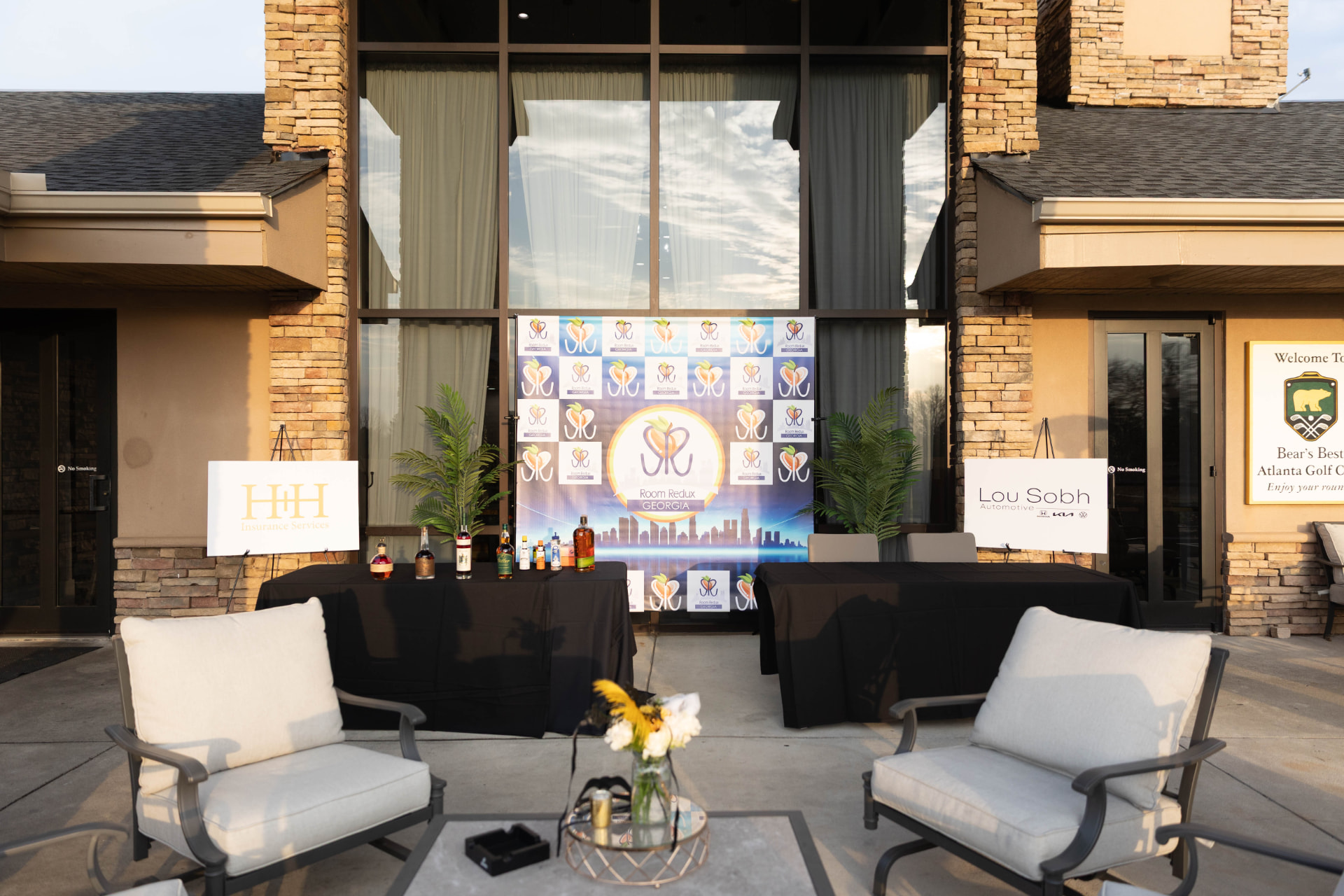 The Moonlight Masquerade Gala welcome terrace at Bear's Best, with the Room Redux of Georgia step and repeat backdrop.