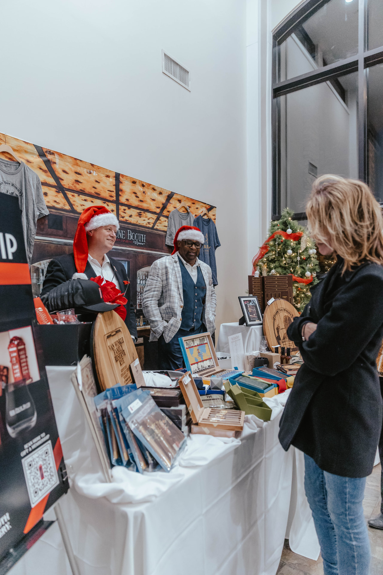 Vendor booth with gifts and holiday items at the Sip & Sparkle Vendor Holiday Market.